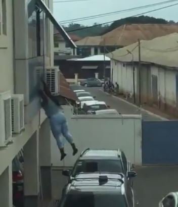 SO SAD!!! See The Scary Moment A Lady Jumps Down From A Window Of A Bank After Robbing (Video)