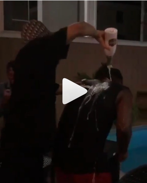 Phyno Pops Champagne On Paul Okoye, Pushes Him Into Pool At His Birthday Party